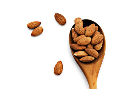 Spoon almond isolated on white backgroundの写真素材