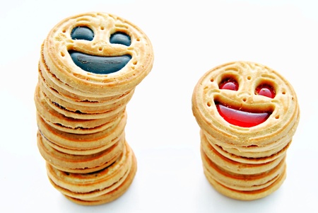 Two groups of cookies, smiling isolated on white backgroundの写真素材