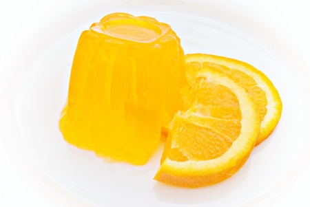 Orange with orange gelatin isolated on white backgroundの写真素材