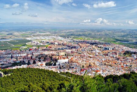 City view from the top of a mountain skies and clouds in the backgroundの写真素材