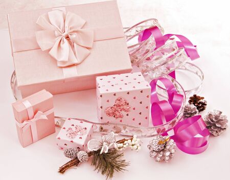Several boxes of gifts with ribbons of different colorsの写真素材