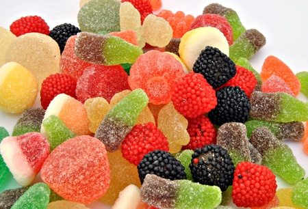 Gumdrops of different colors and shapes stacked next to each otherの写真素材