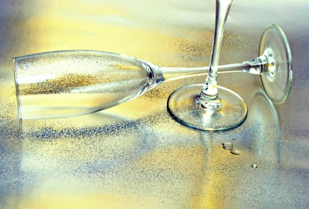 Wine glass in horizontal and vertically on back scatterの写真素材