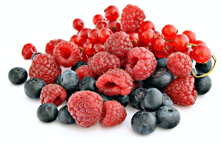 Blackberries blueberries and currants, surrounded by white background