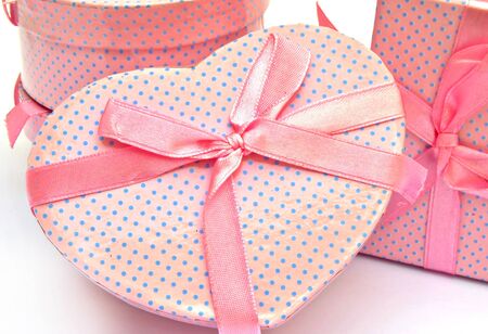 Gift box with ribbon color pink heart-shapedの写真素材