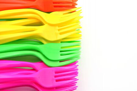 Holders of multiple colors stacked next to each other, forming a vertical backgroundの写真素材