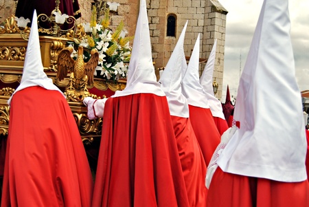 Group Nazarenes with their hoods during a Holy Week procession in Spain