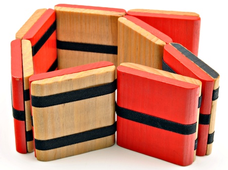 Puzzle of several pieces of wood, surrounded by white backgroundの写真素材