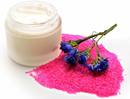 Pot of cream to pink stones, with purple flowerの写真素材