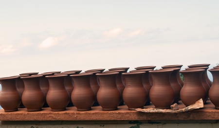Ceramic pots next to each other in rowsの写真素材