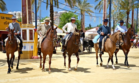 Riders on horseback walking through the real show horse at the fair the day May 12, 2012 in Jerez de la Frontera, Spain のeditorial素材