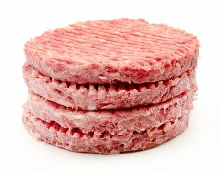 Several burgers on top of each other surrounded by white backgroundの写真素材