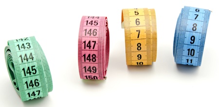 Tape measure on white background