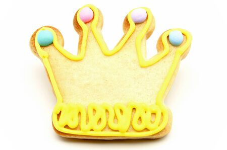 Cookie decorated with a crown on white backgroundの写真素材