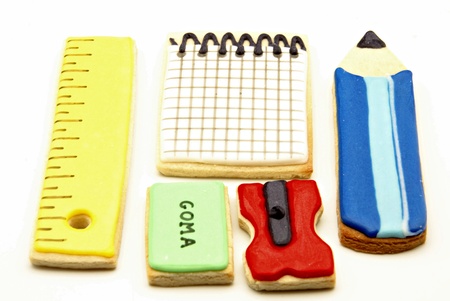 Glazed cookies shaped school supplies on white backgroundの写真素材