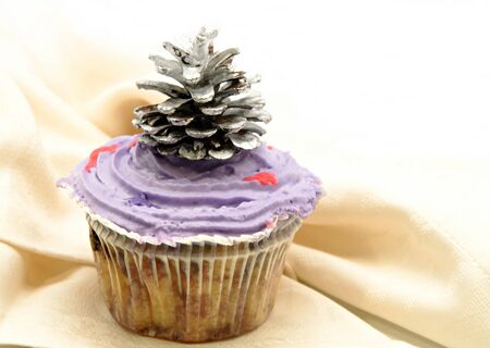 Delicious cupcakes decorated with cream and candy colored ornaments