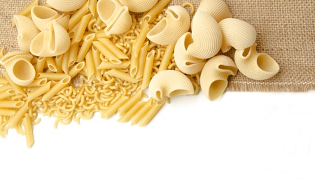 Assorted raw pasta ready for cookingの写真素材
