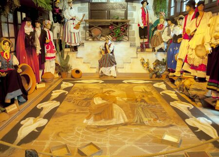 Dolls dressed in costume, along with a check with sand matのeditorial素材