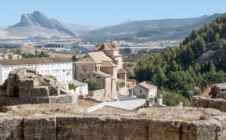 View Antequera Castle wall located in the Spanish province of Malaga is surrounded by white houses, and surrounded by its mountains and fieldsのeditorial素材