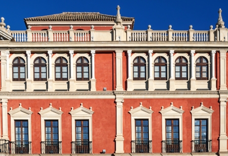 Orange facade with various types of windowsの写真素材