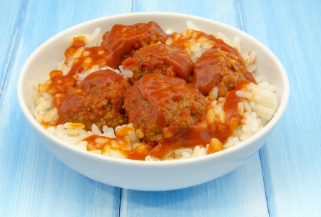 Stewed meatballs with rice and tomato sauceの写真素材