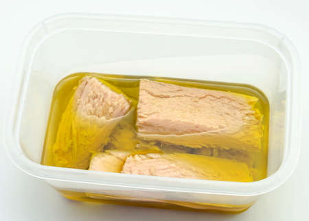 Several pieces of tuna in olive oilの写真素材