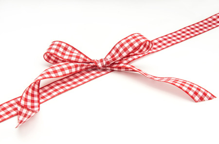 Red tie with white boxes on white backgroundの写真素材