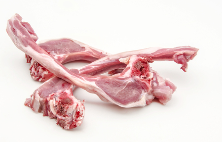 Several raw lamb chops on white backgroundの写真素材