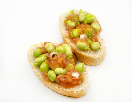 Bread with tomato, onion and raw beansの写真素材