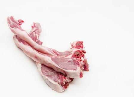 Several raw lamb chops on white backgroundの写真素材