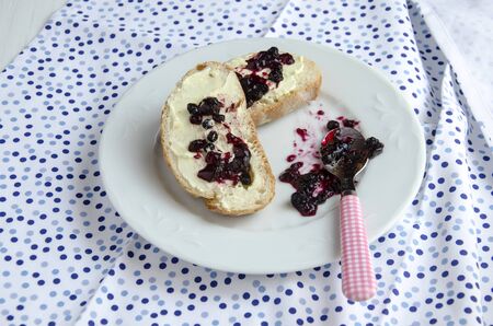 Toast with butter cream and blueberry jamの写真素材
