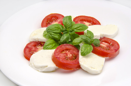 Caprese salad with tomato and mozzarella cheeseの写真素材
