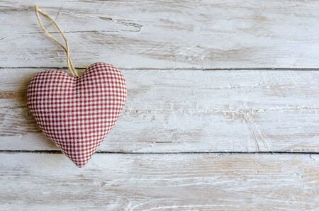 Cloth heart on wooden boardの写真素材