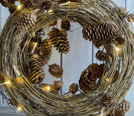 Decorated Christmas wreath on wooden backgroundの写真素材
