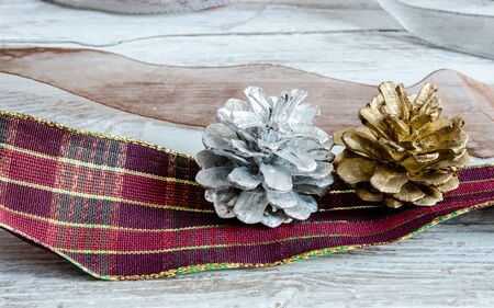 Christmas decoration, ribbons and pine conesの写真素材