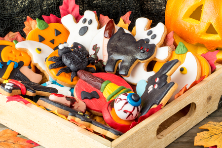 Variety of creative homemade cookies in wooden basket for halloweenの写真素材