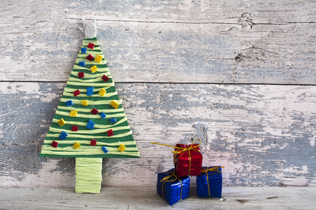 Product handmade colorful christmas tree and three bowls of wood backgroundの写真素材