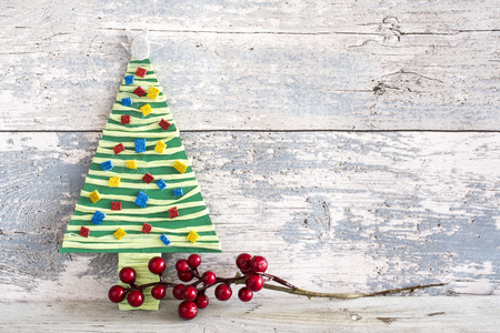 Product handmade colorful christmas tree and three bowls of wood backgroundの写真素材