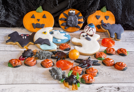 Still life of halloween colorful cookies on wooden backgroundの写真素材