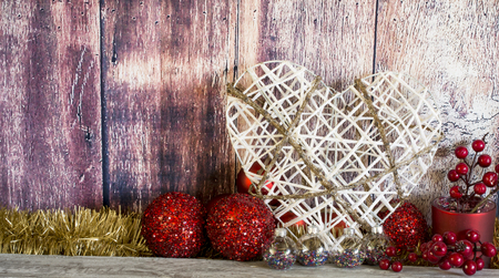 A Christmas decorative composition with heart, balls and spangle. Horizontal studio shot,の写真素材