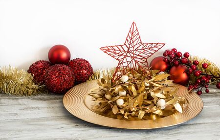 Xmas star laying in golden plate. Horizontal studio shot. の写真素材