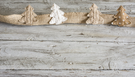 Textile beige colored Christmas trees. Horizontal studio shotの写真素材