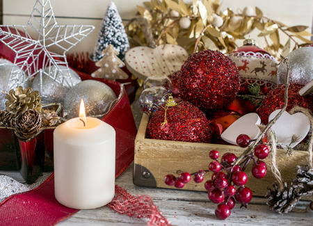 Red and white Christmas decor with candle. Horizontal indoors shotの写真素材