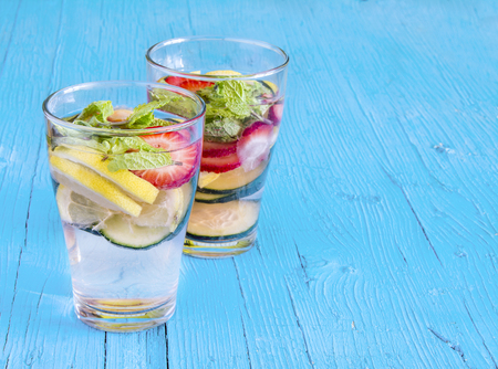 Dietary detox drink with lemon juice, strawberries and cucumber.の写真素材