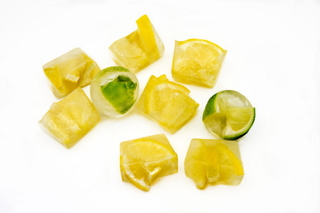 Ice cubes with frozen lemonsの写真素材