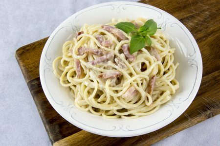 Spaghetti with carbonara sauce and baconの写真素材