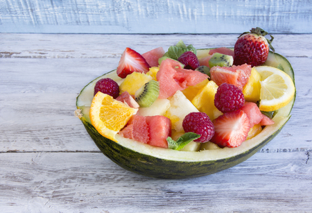 Melon stuffed with fresh mixed fruitの写真素材