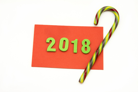 Red card congratulating christmas and year 2018, on white backgroundの写真素材