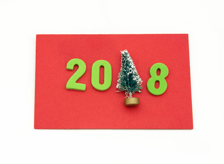 Red card congratulating christmas and year 2018, on white backgroundの写真素材