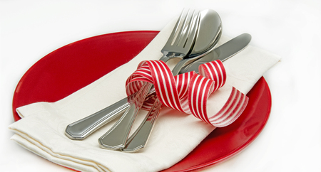 Dish with napkin and cutlery on white backgroundの写真素材